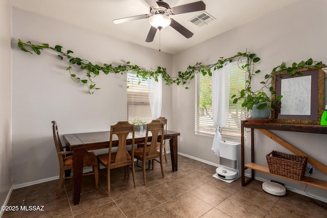 21185 E Reunion Rd, Red Rock, AZ 85145 - dining room with baseboards, a ceiling fan, and tile patterned floors