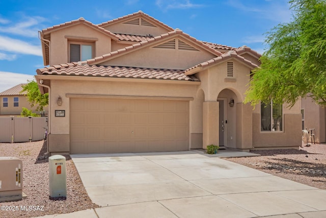 21185 E Reunion Rd, Red Rock, AZ 85145 - mediterranean / spanish house featuring an attached garage, driveway, a tiled roof, and stucco siding