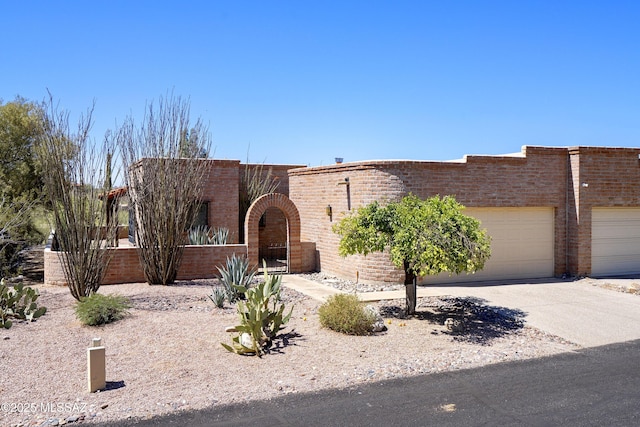 5790 E Chiricahua Trl, Tucson, AZ 85750 - view of front of house with driveway and a garage