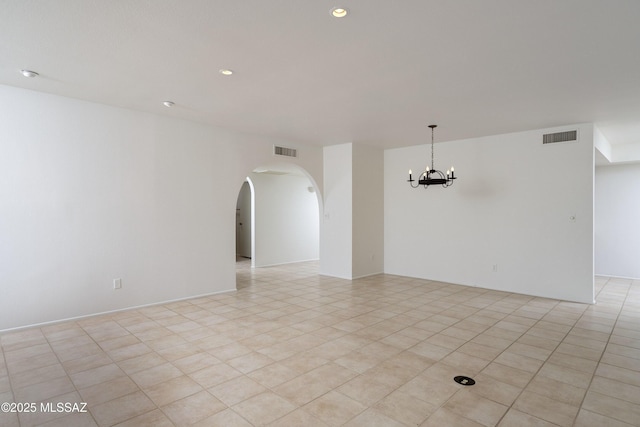 5790 E Chiricahua Trl, Tucson, AZ 85750 - unfurnished room featuring a chandelier, arched walkways, and recessed lighting