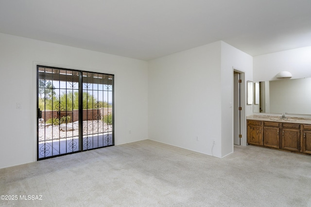 5790 E Chiricahua Trl, Tucson, AZ 85750 - unfurnished room with a sink and light colored carpet