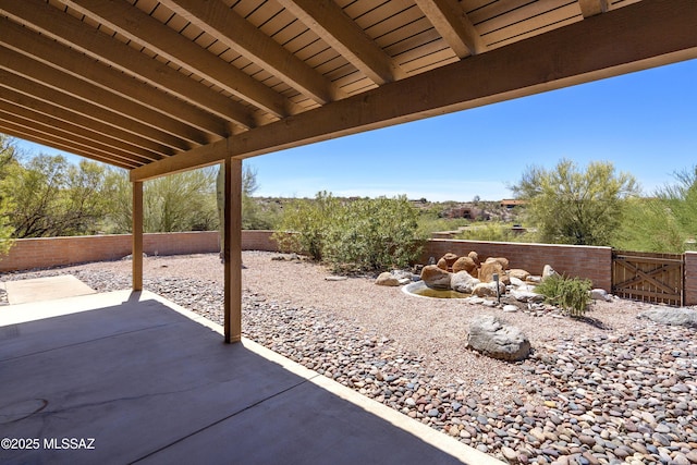 5790 E Chiricahua Trl, Tucson, AZ 85750 - fenced backyard with a patio and a gate