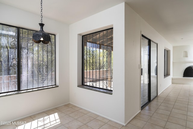 5790 E Chiricahua Trl, Tucson, AZ 85750 - unfurnished dining area with tile patterned floors and baseboards