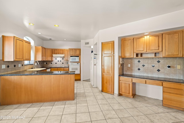 12220 E 5th St, Tucson, AZ 85748 - kitchen featuring white appliances, a sink, tasteful backsplash, a peninsula, and light tile patterned flooring