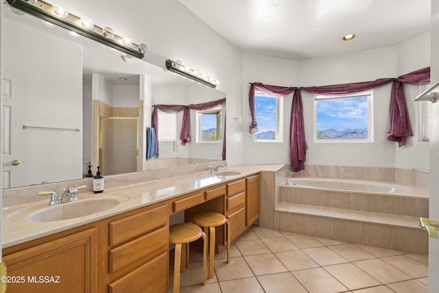 12220 E 5th St, Tucson, AZ 85748 - full bathroom featuring a stall shower, a bath, double vanity, and tile patterned floors