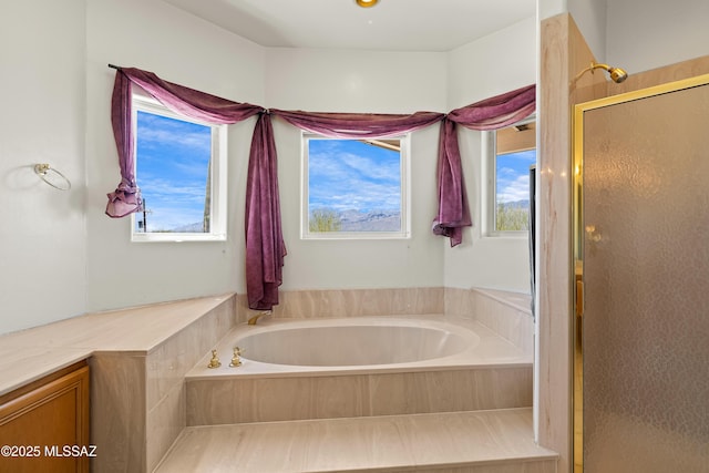 12220 E 5th St, Tucson, AZ 85748 - bathroom featuring healthy amount of natural light, a shower stall, and a garden tub