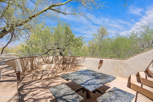 12220 E 5th St, Tucson, AZ 85748 - view of patio featuring an outdoor fire pit
