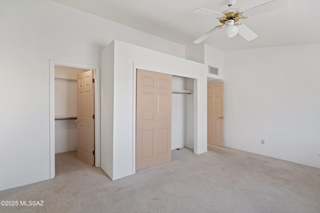 12220 E 5th St, Tucson, AZ 85748 - unfurnished bedroom with light carpet, a closet, vaulted ceiling, and ceiling fan