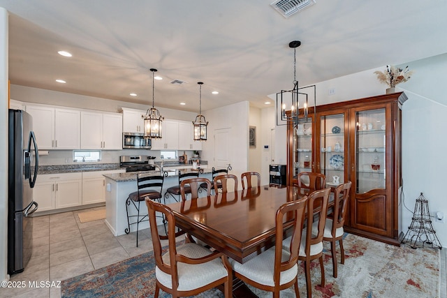 11267 S Weismann Dr, Vail, AZ 85641 - dining space featuring a chandelier, recessed lighting, and light tile patterned flooring