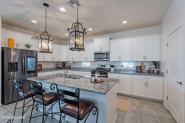 11267 S Weismann Dr, Vail, AZ 85641 - kitchen featuring appliances with stainless steel finishes, a sink, a chandelier, recessed lighting, and white cabinetry