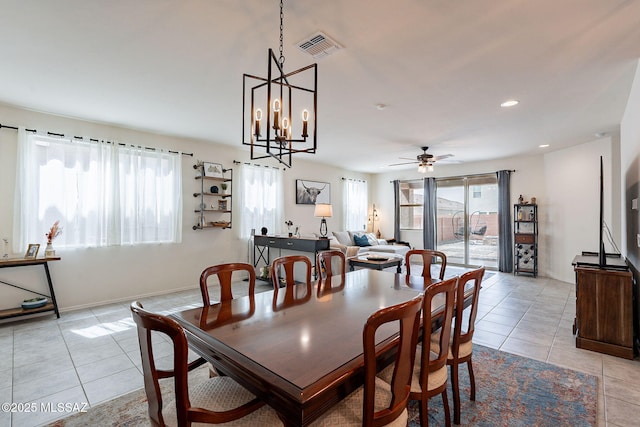 11267 S Weismann Dr, Vail, AZ 85641 - dining space with light tile patterned floors, ceiling fan, baseboards, a chandelier, and recessed lighting