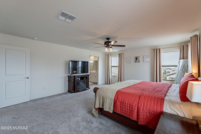 11267 S Weismann Dr, Vail, AZ 85641 - bedroom featuring multiple windows, carpet floors, ceiling fan, and a fireplace