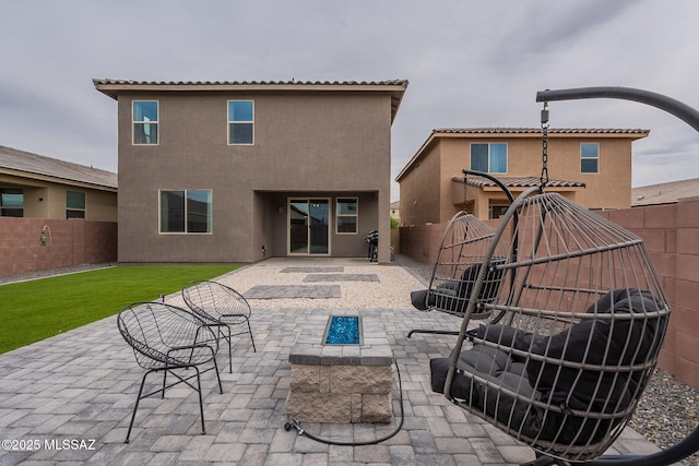 11267 S Weismann Dr, Vail, AZ 85641 - rear view of house with a fire pit, a patio, and stucco siding