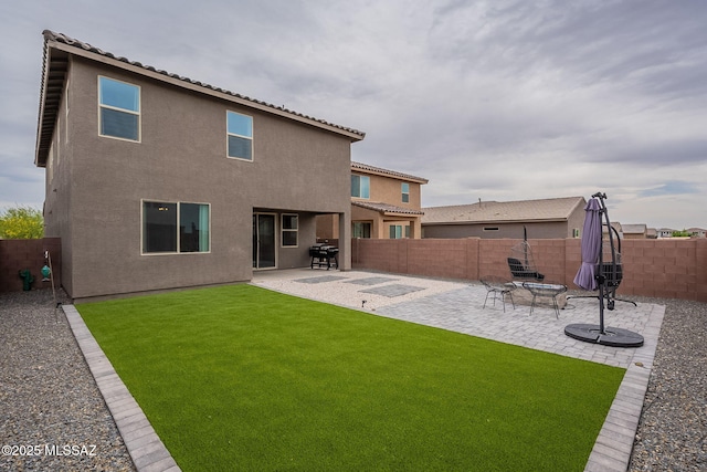 11267 S Weismann Dr, Vail, AZ 85641 - rear view of house featuring a patio, stucco siding, and a tile roof