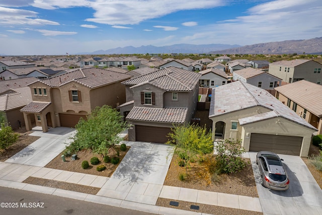 11267 S Weismann Dr, Vail, AZ 85641 - view of front of house featuring a residential view, driveway, stucco siding, and a mountain view