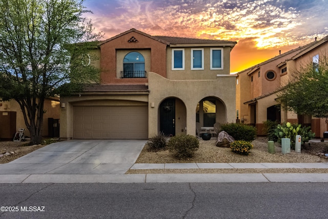 10676 S Miramar Canyon Pass, Vail, AZ 85641 - mediterranean / spanish house with stucco siding, an attached garage, concrete driveway, and a tile roof