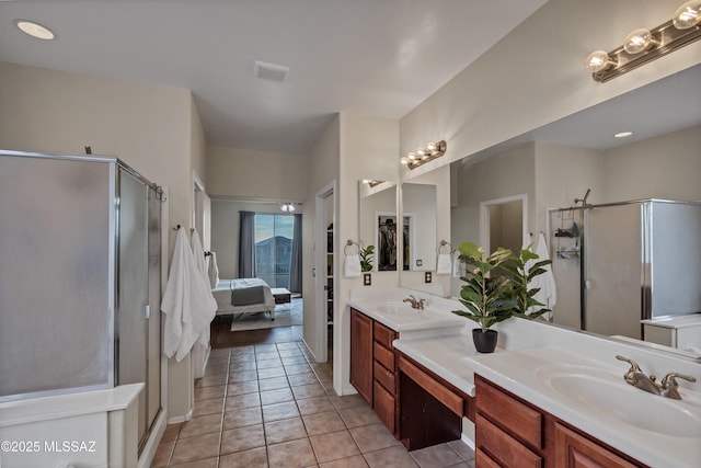 10676 S Miramar Canyon Pass, Vail, AZ 85641 - ensuite bathroom featuring double vanity, a stall shower, and tile patterned flooring