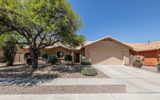 9664 E Paseo, San Rosendo, Tucson, AZ 85747 - ranch-style home featuring a tile roof, an attached garage, stucco siding, and driveway