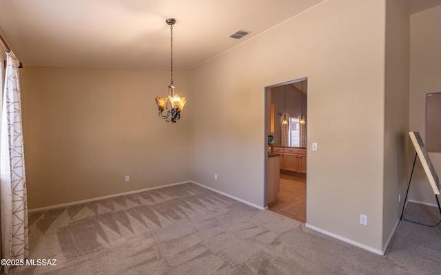 9664 E Paseo, San Rosendo, Tucson, AZ 85747 - spare room featuring light carpet, a chandelier, baseboards, and healthy amount of natural light