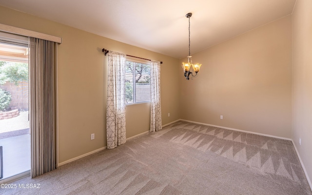 9664 E Paseo, San Rosendo, Tucson, AZ 85747 - spare room featuring carpet flooring, a chandelier, baseboards, and vaulted ceiling