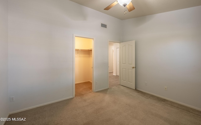 9664 E Paseo, San Rosendo, Tucson, AZ 85747 - unfurnished bedroom with carpet floors, a spacious closet, baseboards, and a closet