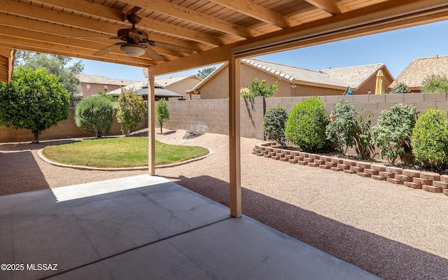 9664 E Paseo, San Rosendo, Tucson, AZ 85747 - fenced backyard with a ceiling fan and a patio area