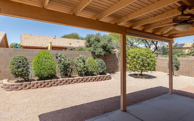 9664 E Paseo, San Rosendo, Tucson, AZ 85747 - fenced backyard with a ceiling fan and a patio area