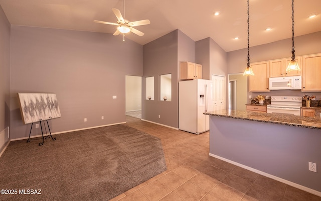 9664 E Paseo, San Rosendo, Tucson, AZ 85747 - kitchen with white appliances, high vaulted ceiling, ceiling fan, dark stone counters, and hanging light fixtures