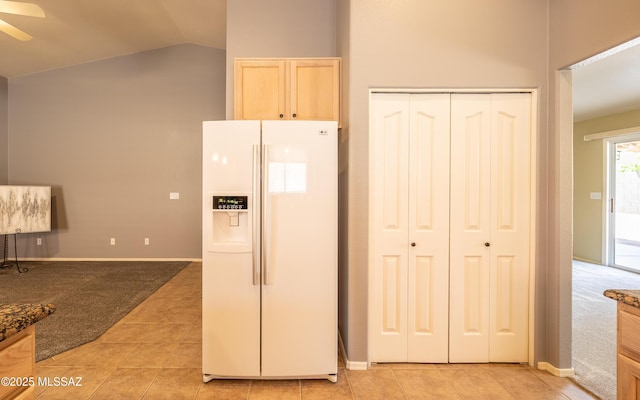 9664 E Paseo, San Rosendo, Tucson, AZ 85747 - kitchen with white fridge with ice dispenser, ceiling fan, lofted ceiling, light carpet, and light brown cabinets