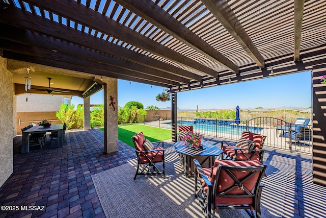 4762 W Placita Casa Sevilla, Marana, AZ 85658 - view of patio featuring outdoor dining space, a fenced backyard, a pergola, and ceiling fan