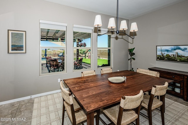 4762 W Placita Casa Sevilla, Marana, AZ 85658 - dining space featuring a chandelier and baseboards