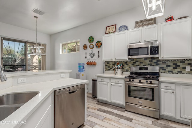 8434 N Sunny Rock Ridge Dr, Tucson, AZ 85743 - kitchen featuring stainless steel appliances, a sink, light countertops, and decorative backsplash