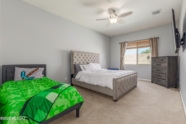 8434 N Sunny Rock Ridge Dr, Tucson, AZ 85743 - bedroom with light carpet, a ceiling fan, and baseboards