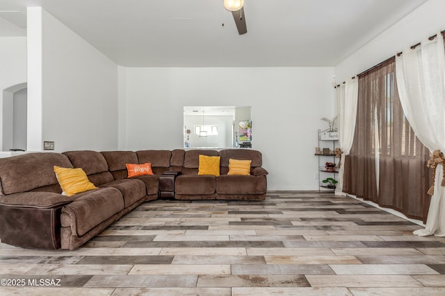 8434 N Sunny Rock Ridge Dr, Tucson, AZ 85743 - living area with wood finished floors and ceiling fan