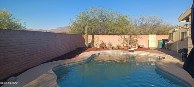 4081 N Hidden Cove Pl, Tucson, AZ 85749 - view of pool with a fenced backyard and a diving board