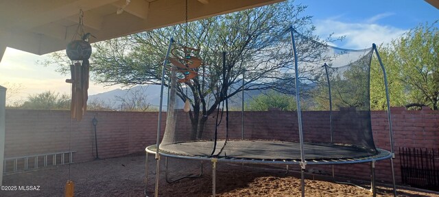 4081 N Hidden Cove Pl, Tucson, AZ 85749 - fenced backyard with a trampoline