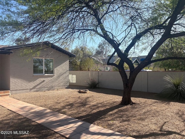 2610 E Elm St, Tucson, AZ 85716 - view of side of home with brick siding