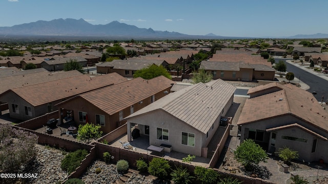 1104 W Pastora Peak Dr, Green Valley, AZ 85614 - aerial view of residential area featuring a mountainous background