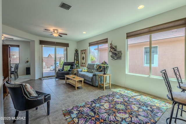 1104 W Pastora Peak Dr, Green Valley, AZ 85614 - tiled living room with ceiling fan and recessed lighting