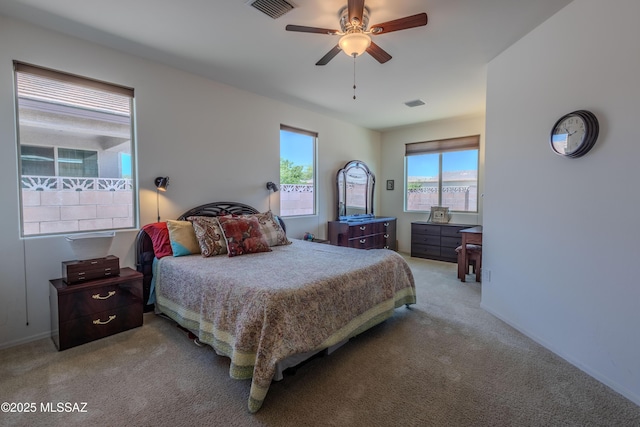 1104 W Pastora Peak Dr, Green Valley, AZ 85614 - bedroom with light carpet, a ceiling fan, and baseboards
