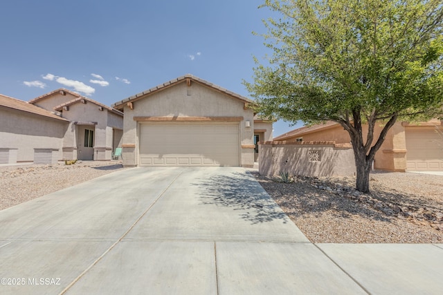 1104 W Pastora Peak Dr, Green Valley, AZ 85614 - view of front of property featuring concrete driveway, stucco siding, a garage, and a tile roof