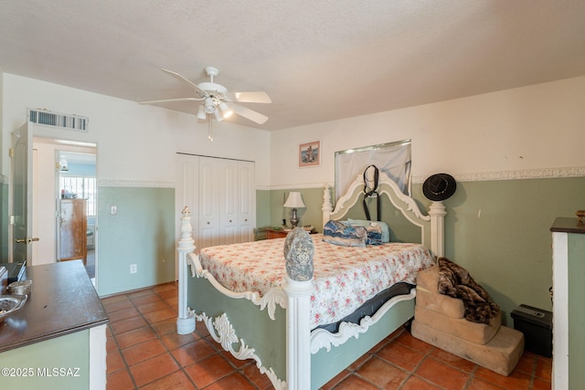 2621 W Rapallo Way, Tucson, AZ 85741 - bedroom featuring a closet, dark tile patterned flooring, and a ceiling fan