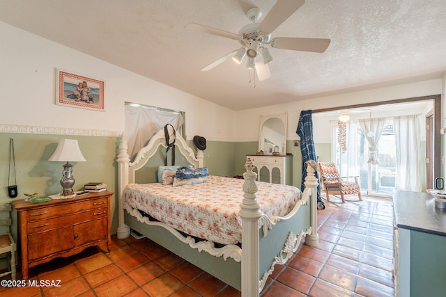 2621 W Rapallo Way, Tucson, AZ 85741 - bedroom with tile patterned flooring, access to exterior, ceiling fan, a textured ceiling, and lofted ceiling
