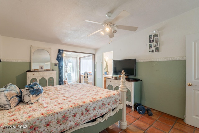 2621 W Rapallo Way, Tucson, AZ 85741 - bedroom featuring tile patterned flooring, a ceiling fan, and a textured ceiling