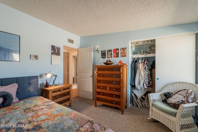 2621 W Rapallo Way, Tucson, AZ 85741 - bedroom featuring a textured ceiling, carpet floors, and a closet