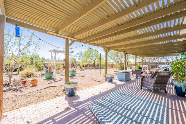 2621 W Rapallo Way, Tucson, AZ 85741 - view of patio / terrace featuring a fenced backyard, an outdoor living space with a fire pit, and a pergola
