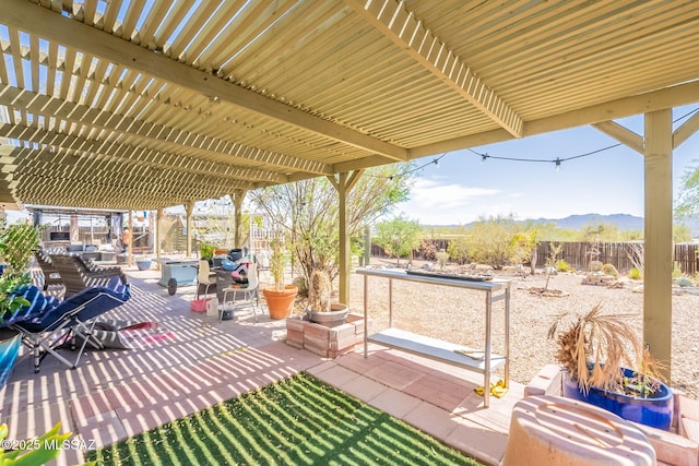 2621 W Rapallo Way, Tucson, AZ 85741 - view of patio / terrace featuring a pergola, a fenced backyard, and a mountain view