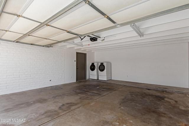 2302 S Cathy Ave, Tucson, AZ 85710 - garage featuring washer and clothes dryer and a garage door opener