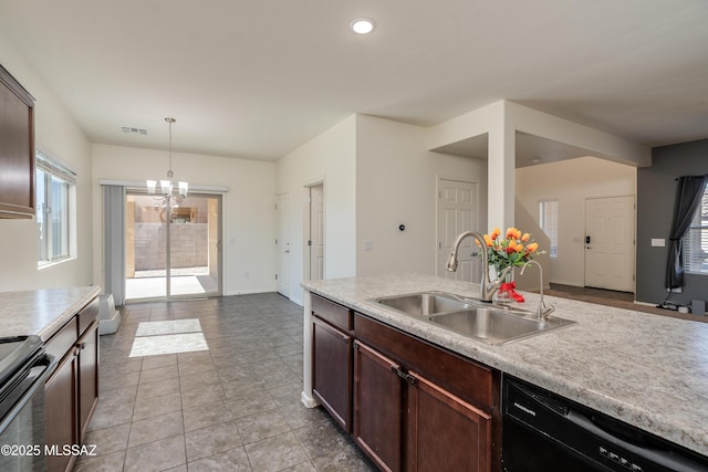 8045 S Red Sox Rd, Tucson, AZ 85756 - kitchen with a sink, black dishwasher, electric range, light countertops, and recessed lighting