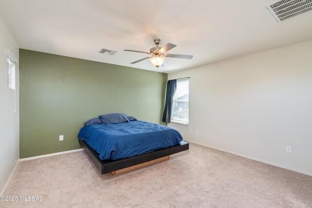 8045 S Red Sox Rd, Tucson, AZ 85756 - carpeted bedroom with baseboards and a ceiling fan